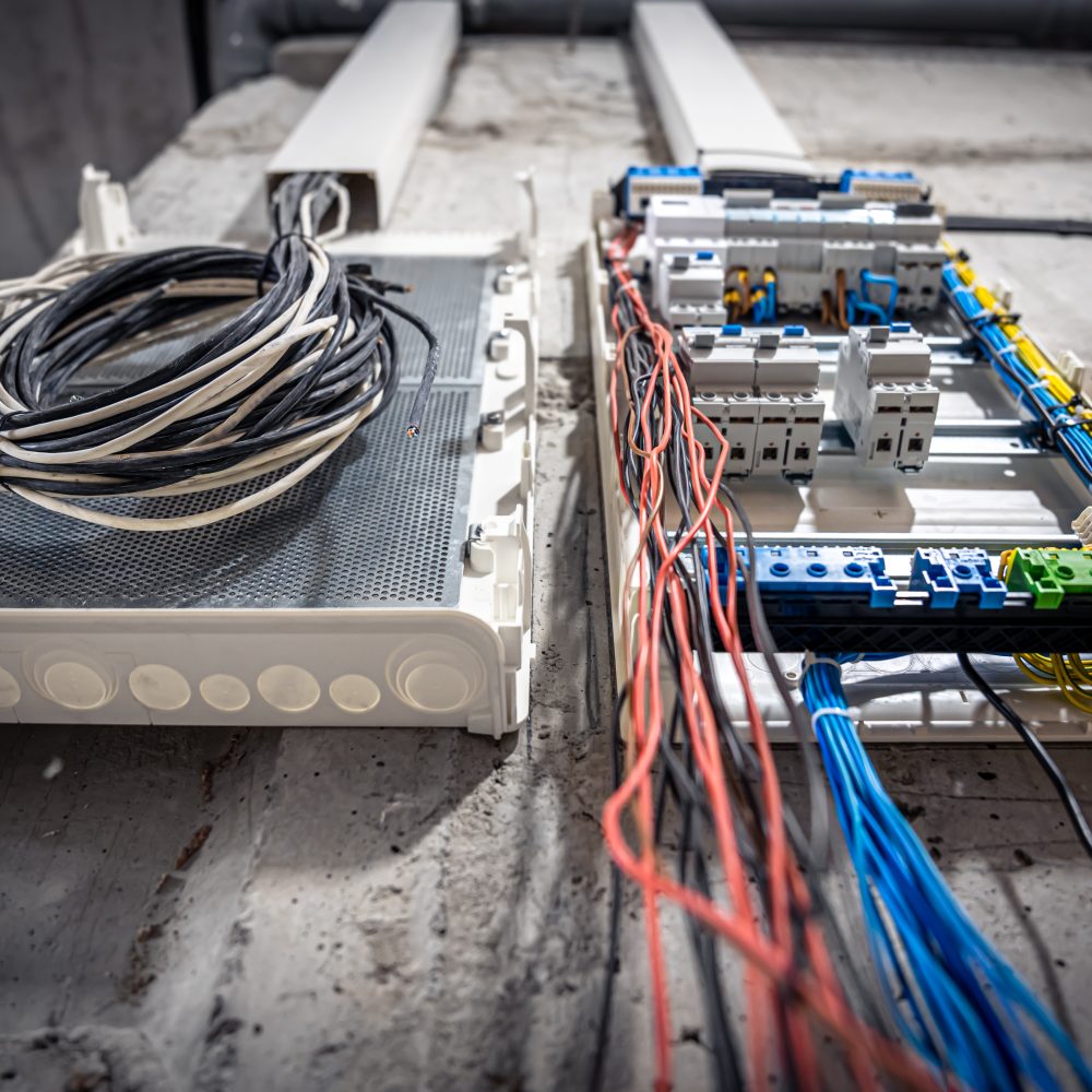 Switchboard with many switches and fiber optic cables.