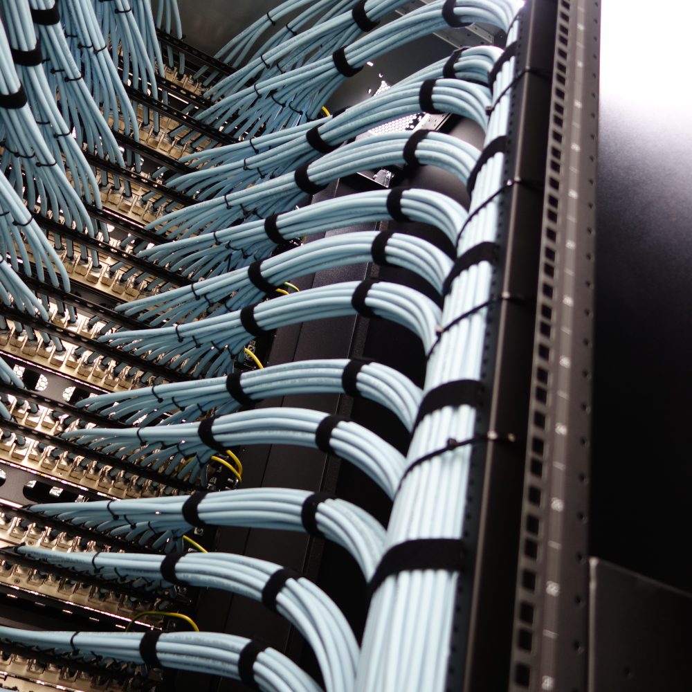 Tidy Network Cables in Data Center Rack with Blue and Black Design